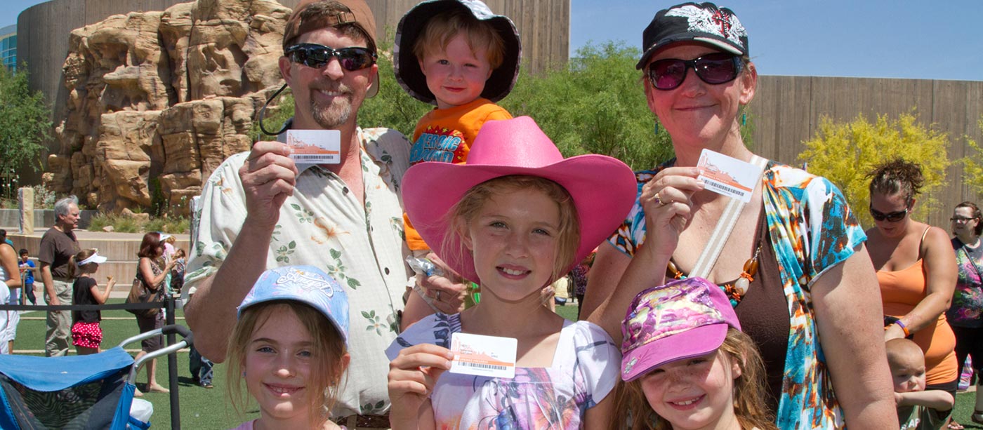Springs Preserve members showing their membership cards