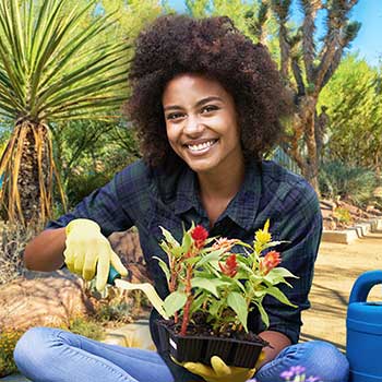 Woman gardening at the Springs Preserve