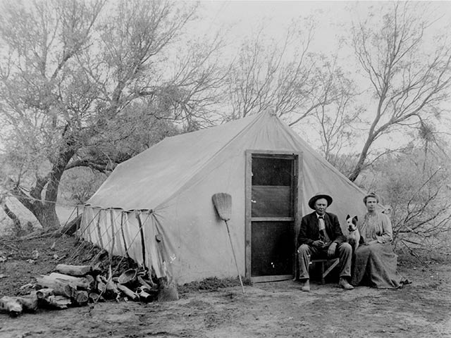 Family sitting by Las Vegas Creek