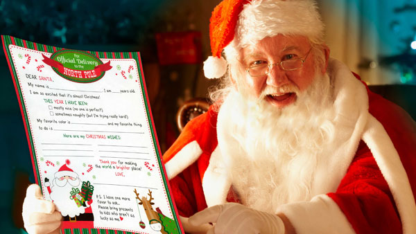 Santa holding a letter from the Springs Preserve Gift Shop
