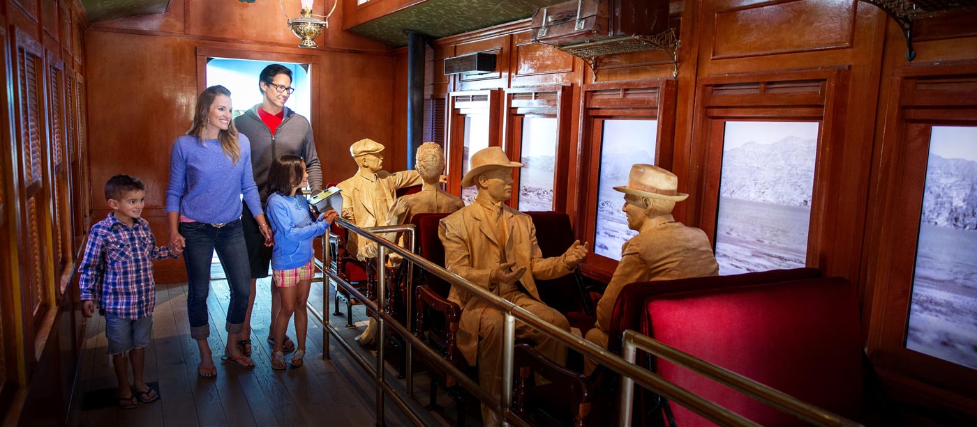 Family views train exhibit at the Origen Museum