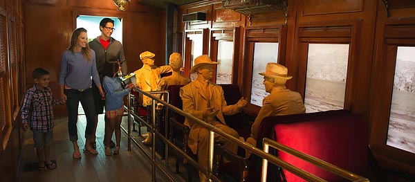 A family explores the railroad exhibit