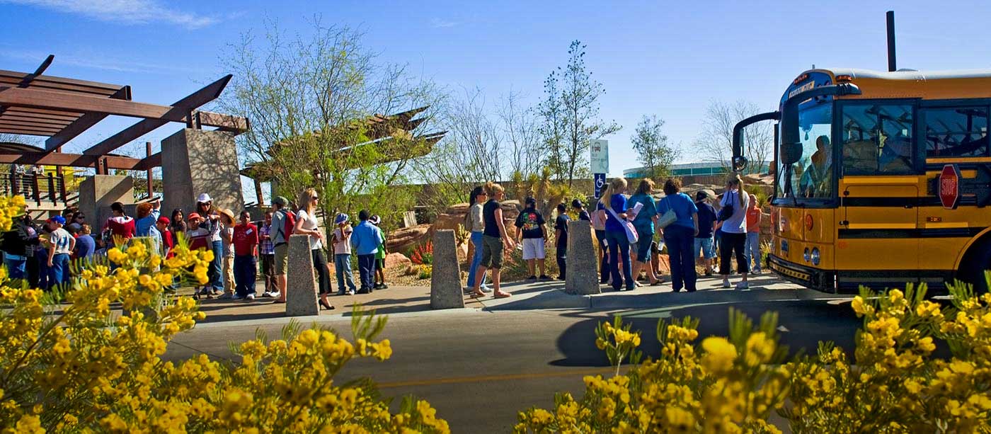 Kids getting off bus in front of the Springs Preserve