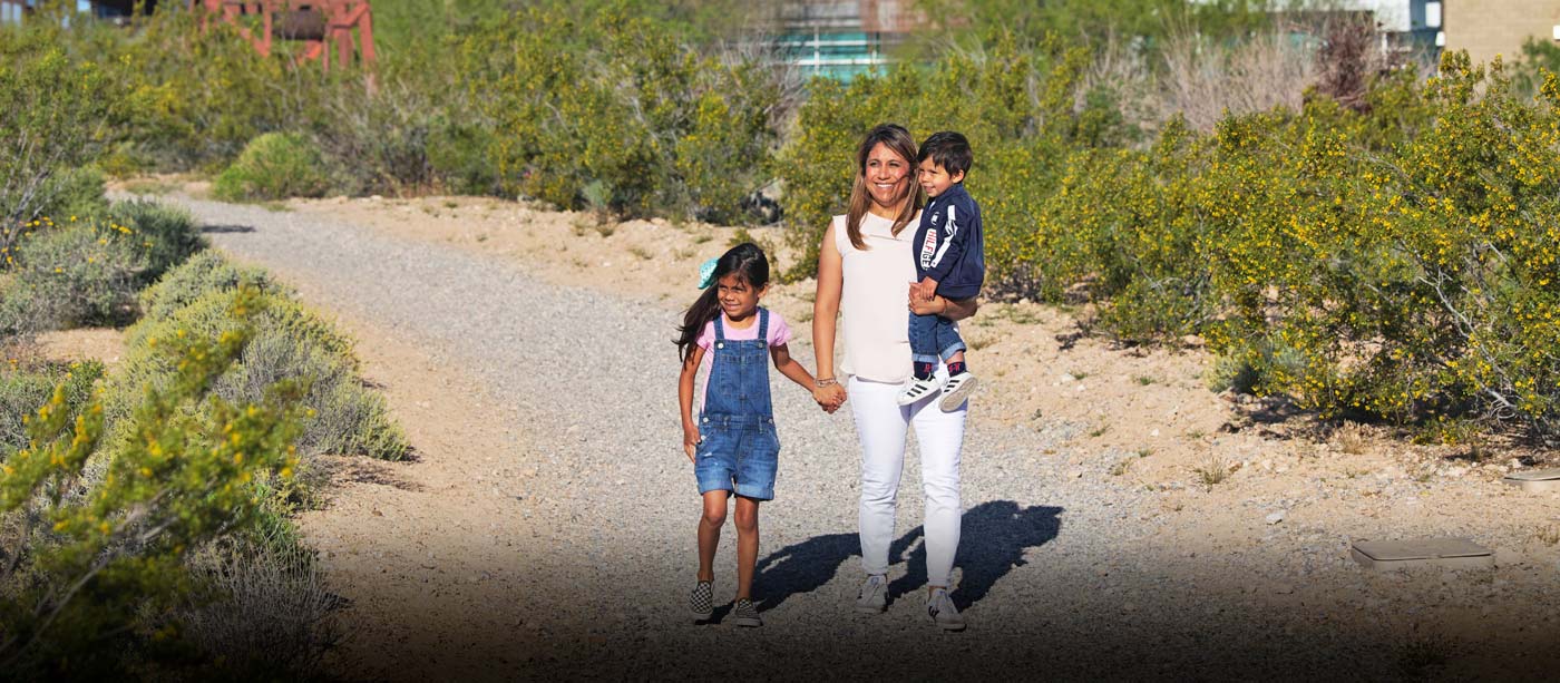 Mother and children walking on the Springs Preserve trails